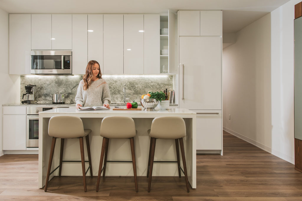 Woman in her 'A'a'li'i condo's kitchen